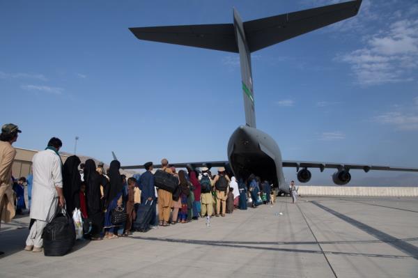 In this handout provided by U.S. Central Command Public Affairs, U.S. Air Force loadmasters and pilots assigned to the 816th Expeditio<em></em>nary Airlift Squadron, load passengers aboard a U.S. Air Force C-17 Globemaster III in support of the Afghanistan evacuation at Hamid Karzai Internatio<em></em>nal Airport (HKIA) on August 24, 2021 in Kabul, Afghanistan