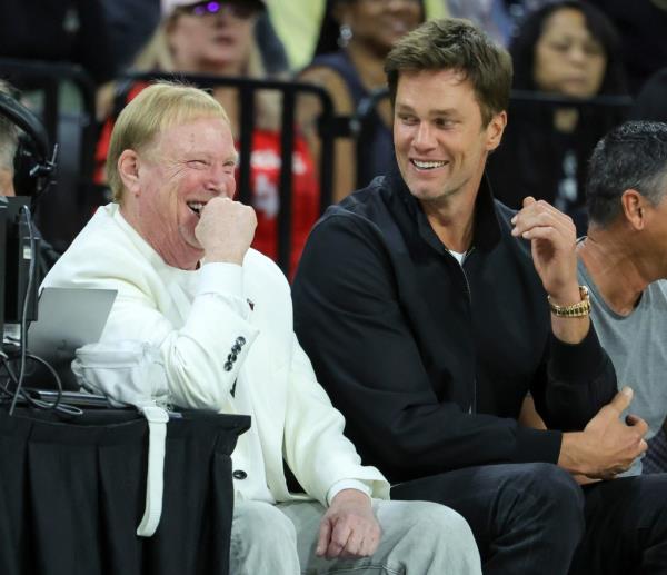 Mark Davis and Tom Brady laugh as they attend Game 1 of the 2023 WNBA Playoffs finals.