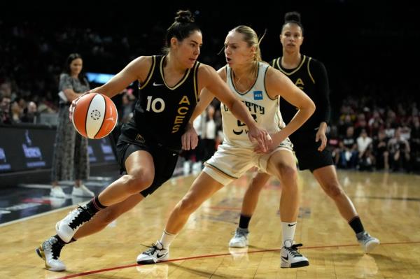 Kelsey Plum drives around New York Liberty guard Marine Johannes during the second half in Game 1.