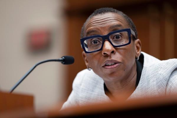 Claudine Gay sitting, speaking into a microphone