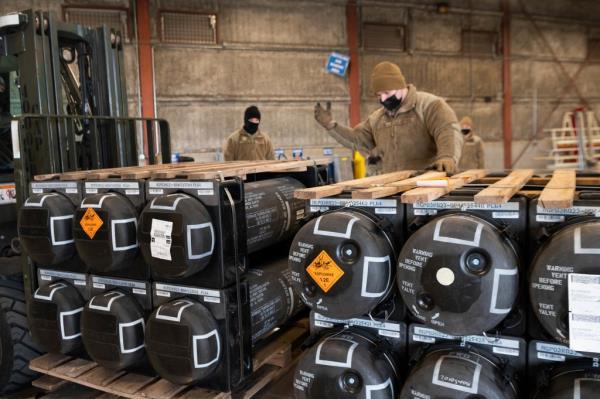Airmen and civilians from the 436th Aerial Port Squadron palletize ammunition, weapons and other equipment bound for Ukraine during a foreign military sales mission at Dover Air Force ba<em></em>se, Del., on Jan. 21, 2022. 