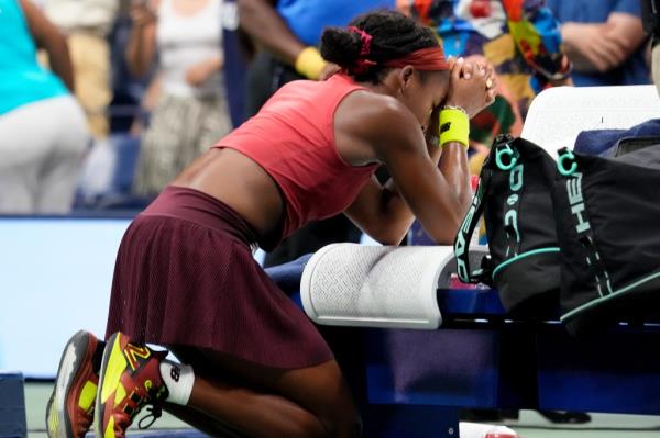Coco Gauff kneels in prayer after winning the US Open. 