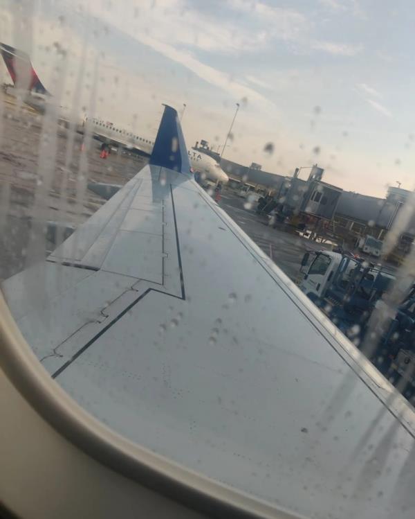 Rainy plane wing.