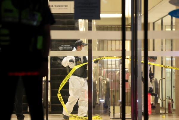 Policemen cordon off a scene wher<em></em>e, according to media reports, nine people have been stabbed and four others hurt by a car driven by the suspected attacker in Seongnam, South Korea.