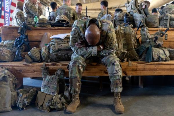 A member of the 82nd Airborne Division of the U.S. Army relaxes ahead of deployment to Poland from Fort Bragg, N.C. on Monday, Feb. 14, 2022