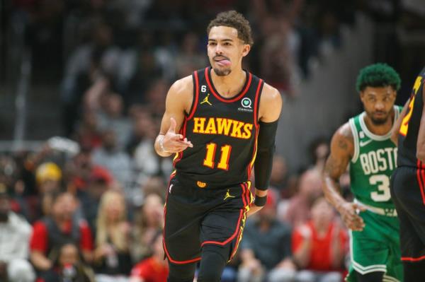 Atlanta Hawks guard Trae Young (11) reacts after a three-pointer against the Boston Celtics in the first quarter during game six of the 2023 NBA playoffs at State Farm Arena.
