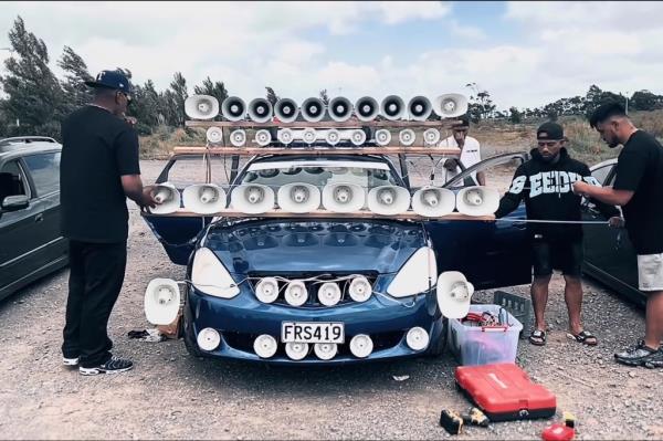 A car with many speakers.