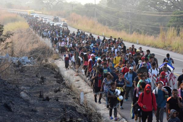 Migrants walk along the highway through Arriaga, Chiapas state in southern Mexico, Monday, Jan. 8. 