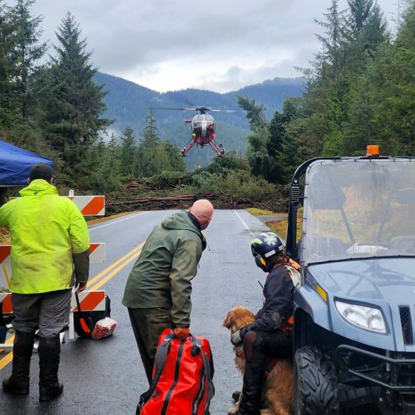 a helicopter arriving near mile 11 of the Zimovia Highway wher<em></em>e ground teams, including search and rescue dogs, are actively working to search areas that state geologists have determined safe for entry Wednesday, Nov. 22, 2023, in Wrangell, Alaska, following a massive landslide earlier in the week.