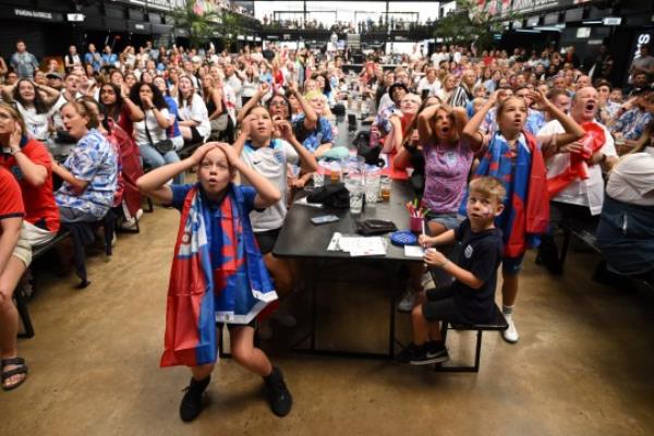 LONDON, ENGLAND - AUGUST 16: England fans react as they watch the FIFA Women's World Cup Australia & New Zealand 2023 Semi Final match between England and Australia at Boxpark Wembley on August 16, 2023 in London, England. (Photo by Leon Neal/Getty Images)
