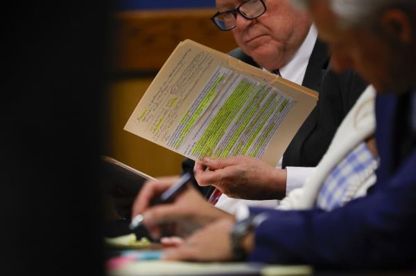 Attorney Craig Gillen, who represents David Shafer, holds up notes during a hearing on the Georgia election interference case, at the Fulton County Courthouse.