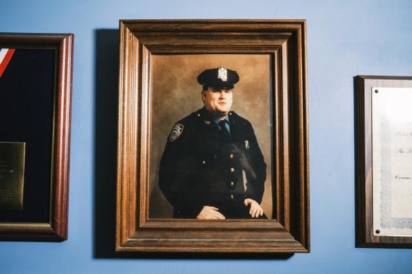A f<em></em>ramed portrait of NYPD officer Anthony Dwyer hangs in his mother's home.