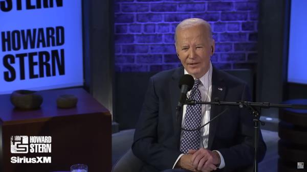 Joe Biden speaking into the microphone in the studio.