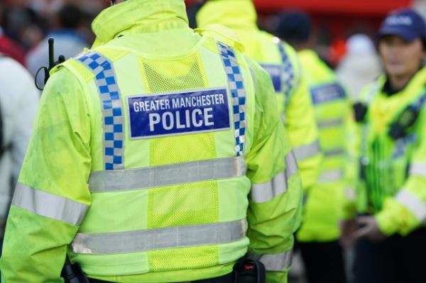 Greater Manchester police outside the stadium ahead of the UEFA Champions League quarter-final first leg match at Old Trafford, Manchester. Picture date: Thursday April 13, 2023.