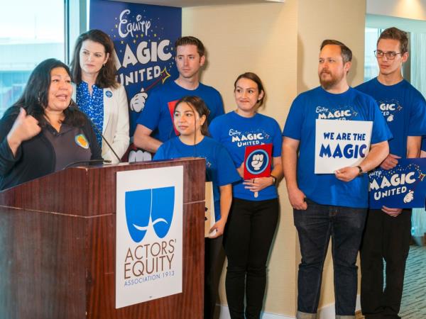 Gloria Alvarado, director of the Orange County Labor Federation, with Disneyland workers.