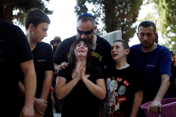 Friends and family mourn Daniella Dana Petrenko, from Haifa who was killed in a deadly attack by Hamas gunmen at a festival, which she attended with her boyfriend, at her funeral in Haifa, Israel, October 13, 2023.