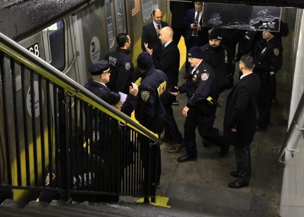 Police investigate subway shooting.
