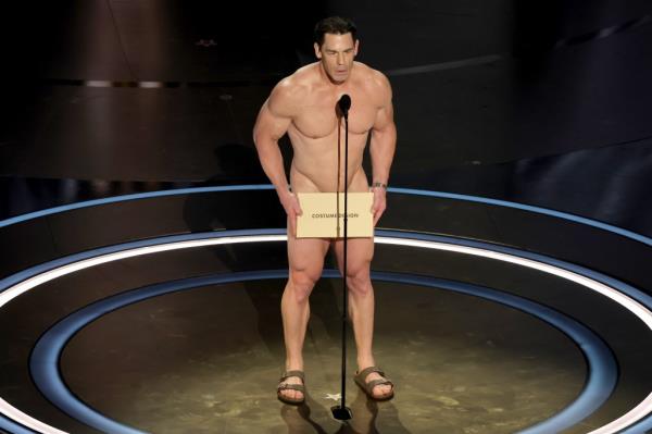 John Cena standing in front of a mic naked. 