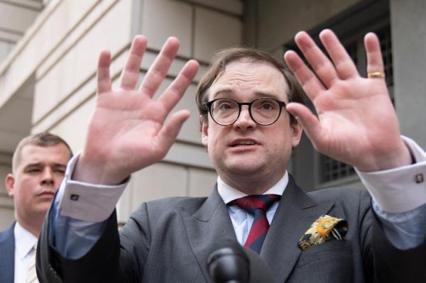 Samuel Dewey (front) representing the co<em></em>nservative think tank The Heritage Foundation, speaks to reporters outside the federal courthouse in Washington, Tuesday, June 6, 2023.