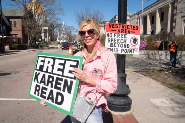 A supporter holding a sign. 