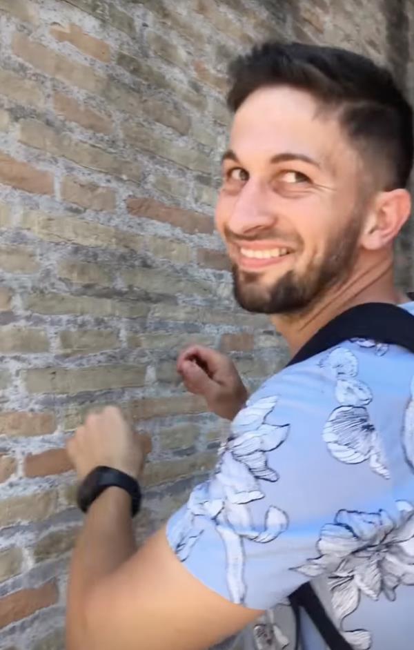 Ivan Dimitrov smiles as he carves up Colosseum wall