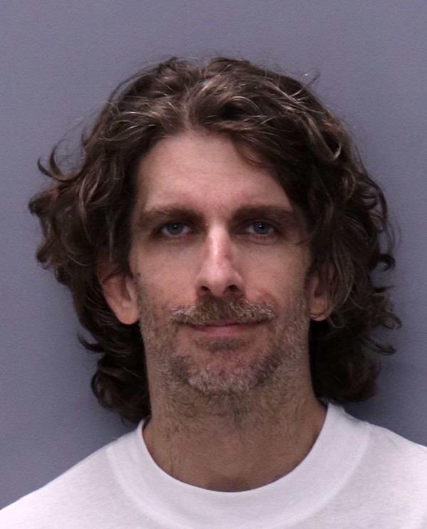 Max Azzarello, a man with long hair and beard, who was involved in an incident outside Manhattan court during a trial