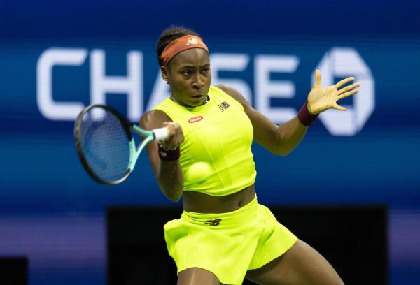 Coco Gauff returns a volley against Carolina Muchova as they play the women's single semifinal on Arthur Ashe Stadium.