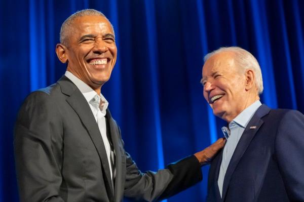 Biden and Obama share a  laugh during Thursday's event in New York City.