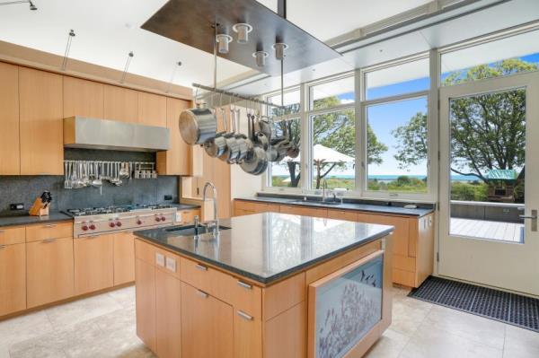 The kitchen with a fireplace.
