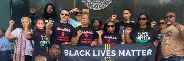 Group of people with Black lives matter banner