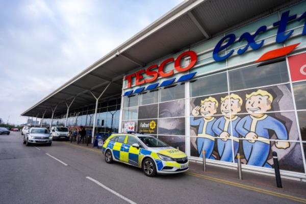 Hanley, Stoke on Trent, Staffordshire - 16th December 2018 - Police attend the large Tesco Express supermarket, store to arrest a shoplifter, thief. Petty crime; Shutterstock ID 1261281997; purchase_order: -; job: -; client: -; other: -