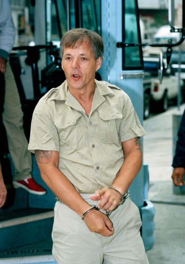 Austrian autor Jack Unterweger shouts at newsmen upon his arrival at federal court in Miami Wednesday, March 4, 1992. 