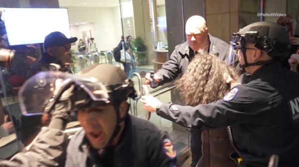 McCarthy could be seen havin<em></em>g trouble getting the glass doors to open as the protesters circled behind him, effectively trapping the cops and yelling profanities. 