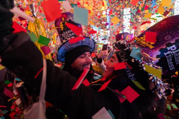 A couple embraces each other and celebrates New Year's in Times Square on Jan. 1, 2024 in New York City.