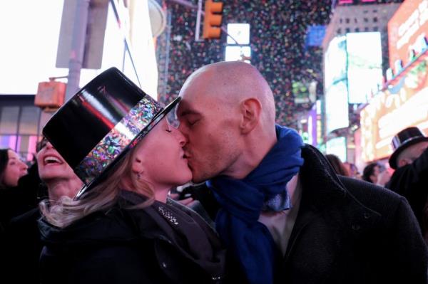 Two people share a kiss as they celebrate New Year's in Times Square on Jan. 1, 2024 in New York City.