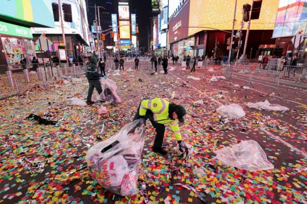 New York Department of Sanitation workers clean up after revelers vacate the area following New Year celebrations at Times Square, in New York City, New York, U.S., Jan. 1, 2024.