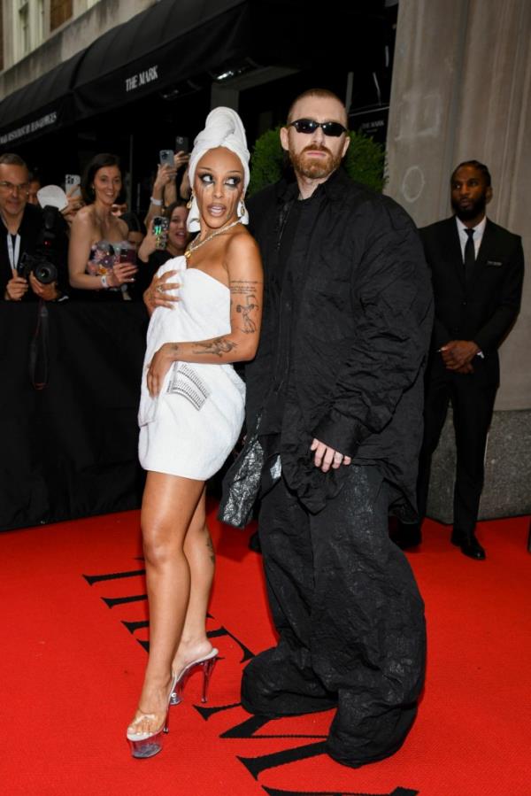 Doja Cat and Guram Gvishiani posing together at The Mark Hotel before the 2024 Met Gala in New York