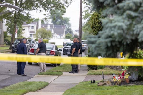 Suffolk County Police along with NY State Police and Nassau County Police investigate Rex Heuermann's home Friday morning.
