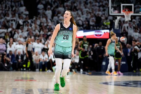 New York Liberty guard Sabrina Io<em></em>nescu celebrates after making a 3-point basket at the end of Game 3 of a WNBA basketball final playoff series against the Minnesota Lynx, Wednesday, Oct. 16, 2024, in Minneapolis. 