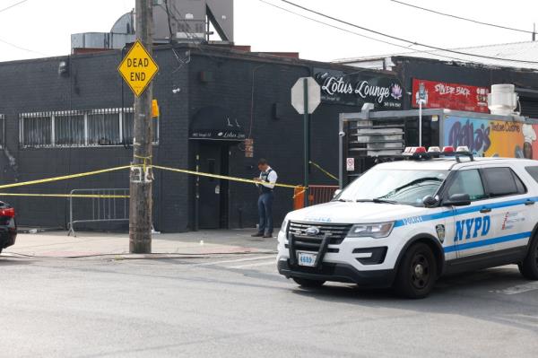 A cop car sits outside the cordo<em></em>ned off Lotus Lounge