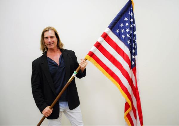 Fabio flying an American flag.