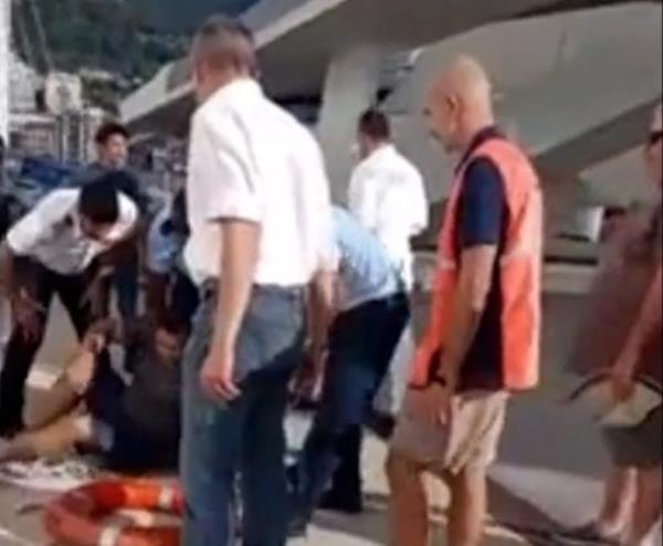 UNCLEARED GRABS: Horrific moment hysterical woman screams ?wher<em></em>e is he? after eight-year-old boy falls into gap between cruise ship and dock at Italian port / 12589709