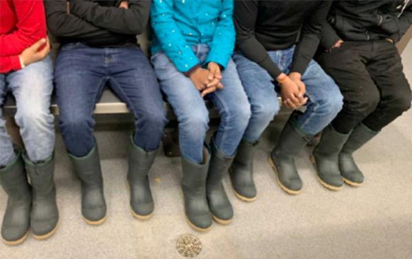 rubber boots worn by migrants crossing borders