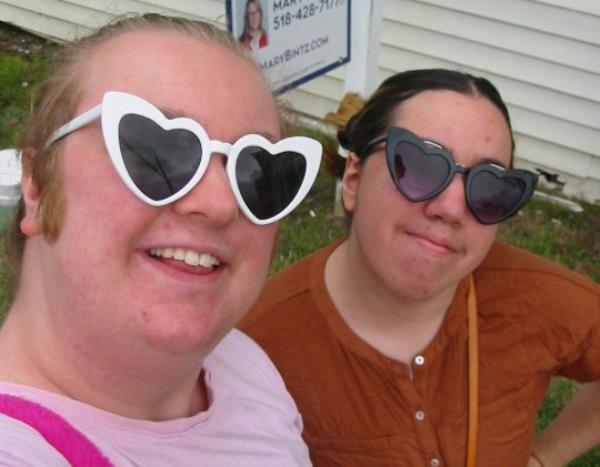 Ash Jayy with fiance, both are wearing heart shaped glasses