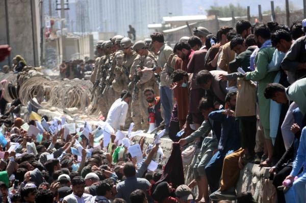 Afghans attempting to evacuated from the country at Kabul's airport during the withrdawal.