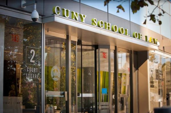 The CUNY School of Law Justice and Auxiliary Service building with glass doors.