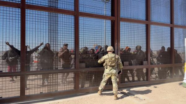 Migrants battle with Natio<em></em>nal Guard soldiers at the border during the March 21 riot at El Paso's gate 36