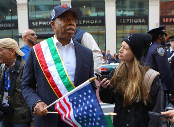 New York Mayor Eric Adams wears an old subway series ba<em></em>seball cap while marching in the annual Columbus Day Parade Monday, Oct. 14, 2024.