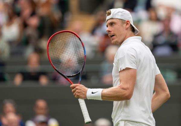 Denis Shapovalov of Canada reacts to a point during his match against Ben Shelton of the United States (not shown) match on day six of The Champio<em></em>nships at All England Lawn Tennis and Croquet Club.