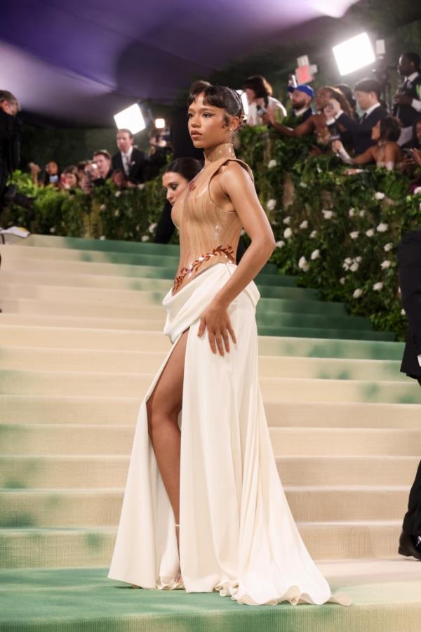 Taylor Russell in a custom-molded bodice designed to resemble wood at the 2024 Met Gala celebrating 'Sleeping Beauties: Reawakening Fashion'.